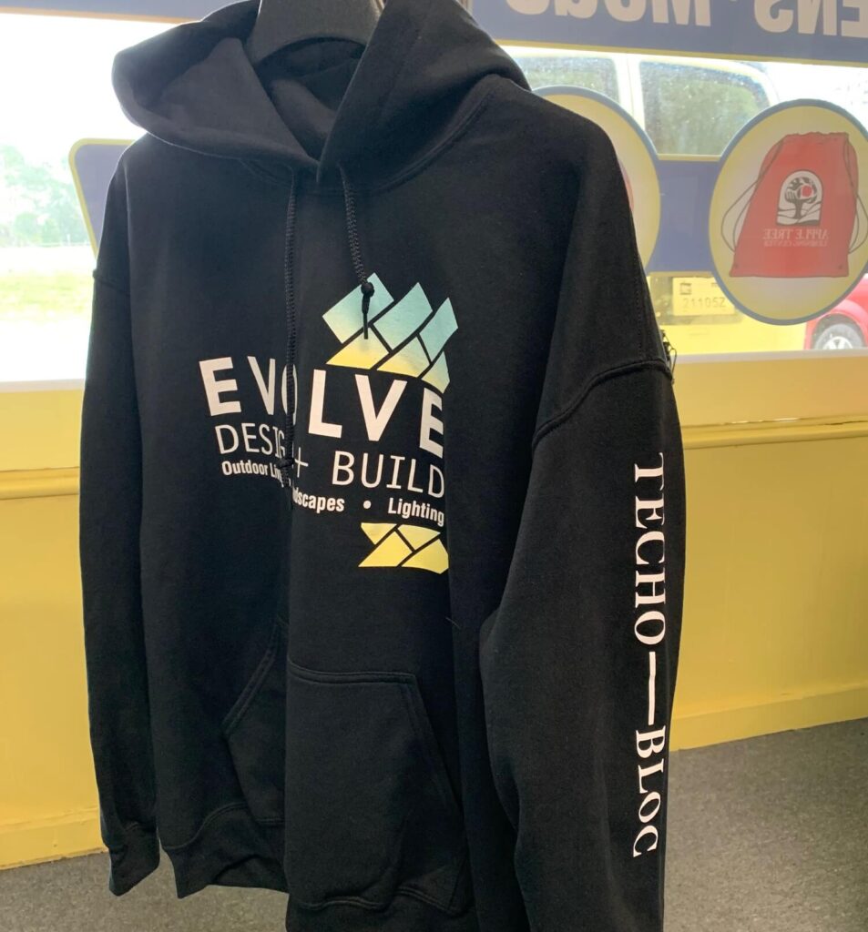 Screen printing on hoodies for Evolve Design and Build
