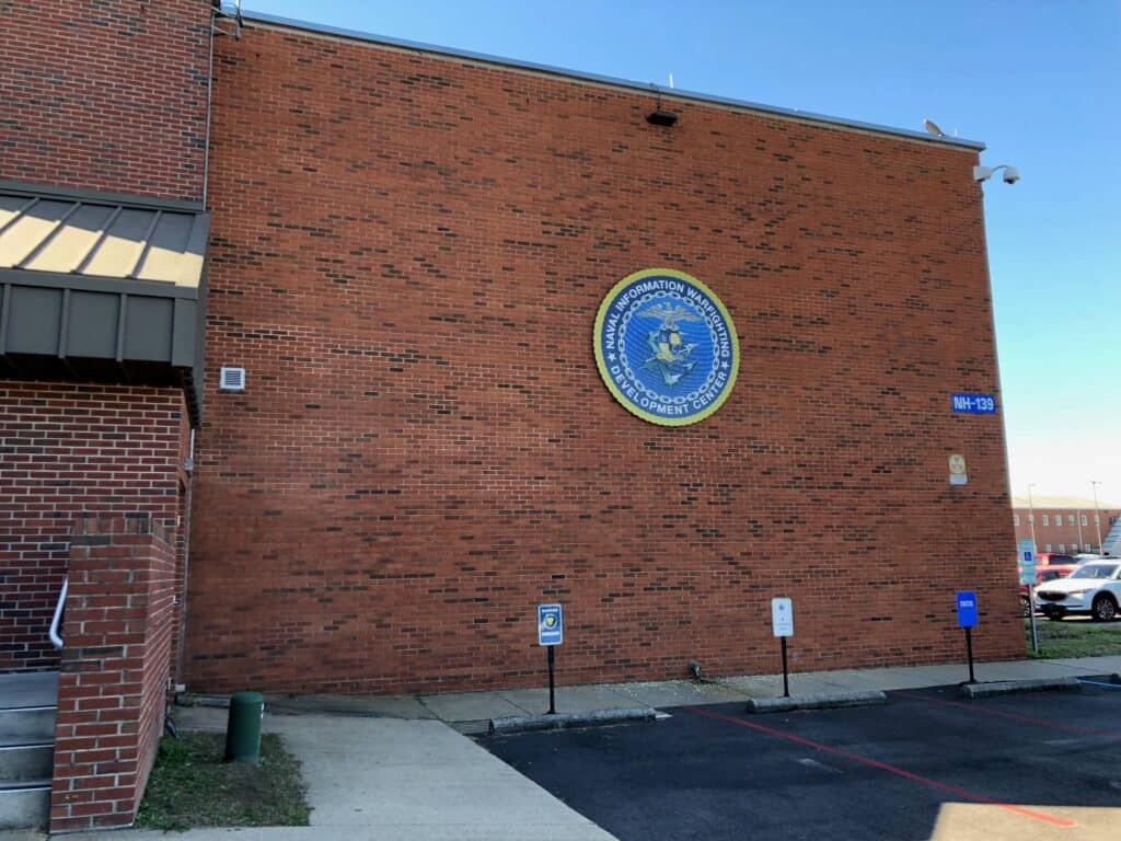 Seal mounted on brick exterior signage Seal mounted on brick exterior signage