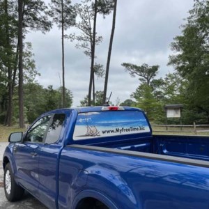 Perforated rear window film graphics on pickup truck from DeSigns, Inc.