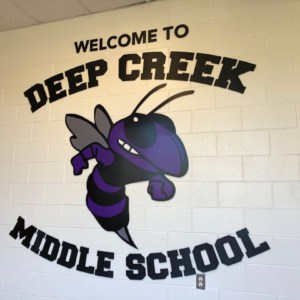School entrance sign, Get sign graphics added to most any surface.