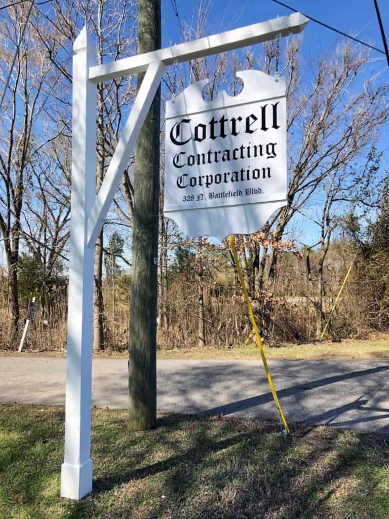 Tall hanging suspended signs - Directory signs - Hanging sign for Cottrell Contracting Corp. Tall hanging suspended signs - Directory signs - Hanging sign for Cottrell Contracting Corp.