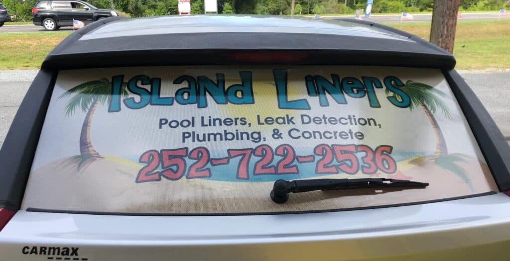 Perforated window film graphics on rear window of car for Island Liners