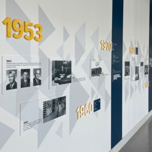 Timeline wall mural with thick plastic letters and PVC mounted photos by DeSigns, Inc.