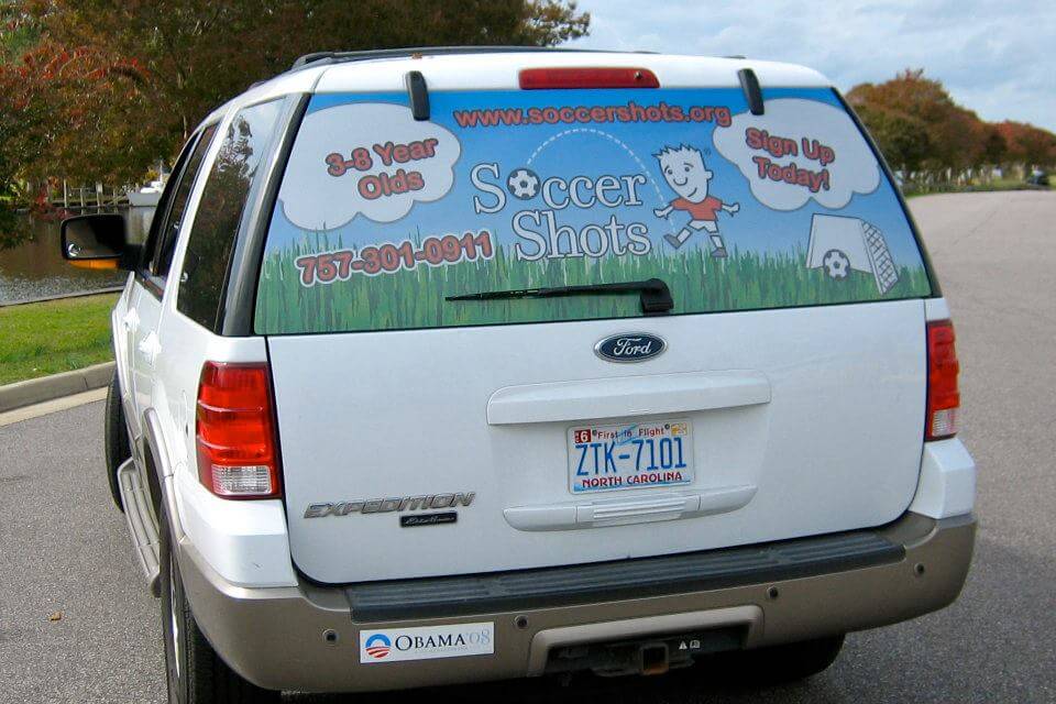 Rear window graphics on SUV, Auto window graphic art for advertising